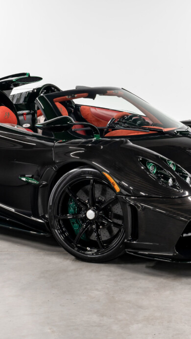 A breathtaking 4K wallpaper featuring the 2024 Pagani Imola Roadster in a striking profile. The image showcases the car's aerodynamic design and luxurious details, capturing its powerful presence and cutting-edge engineering.