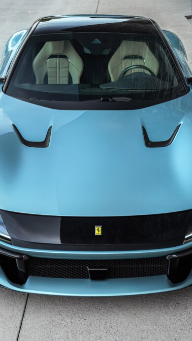 A stunning 4K wallpaper featuring the Ferrari 12Cilindri supercar. The high-resolution image showcases the sleek design and powerful presence of this iconic 12-cylinder vehicle, perfect for automotive enthusiasts