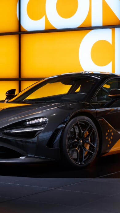 A high-resolution 4K wallpaper featuring the McLaren MCL38 Formula 1 car alongside the McLaren 750S supercar, showcasing their sleek aerodynamic design and vibrant livery in a stunning backdrop.