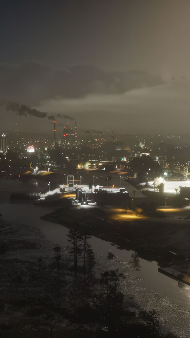 A stunning 4K wallpaper featuring a neon-lit Vice City skyline at night from GTA 6. Skyscrapers glow in vibrant pinks and blues, palm trees sway in the warm breeze, and sleek sports cars cruise the rain-slicked streets, capturing the electrifying atmosphere of the iconic city after dark.