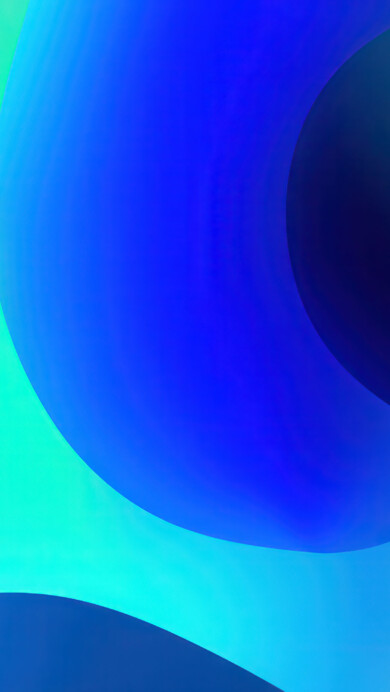 A fluid 4K wallpaper presents an abstract composition of undulating, smooth shapes in a spectrum of blues and teals. The seamless blending of vibrant aqua, royal blue, and deep indigo creates a sense of peaceful depth and continuous, graceful movement.