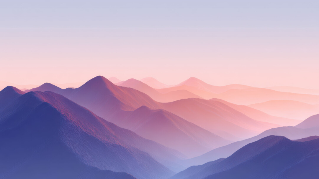 A breathtaking 4K wallpaper featuring a majestic, layered mountain landscape receding into the distance. The atmospheric perspective creates a striking visual, with each mountain layer distinct through a beautiful pastel gradient from rich purples and blues in the foreground to soft pinks and oranges near the horizon, evoking a serene and expansive mood.