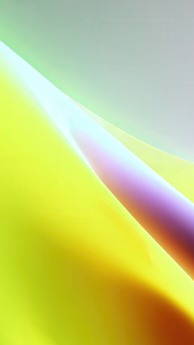 A mesmerizing 4K wallpaper featuring smooth, colorful abstract light waves swirling across a gradient background. The vibrant interplay of greens, yellows, oranges, purples, and blues creates a dynamic, flowing texture and an ethereal mood.