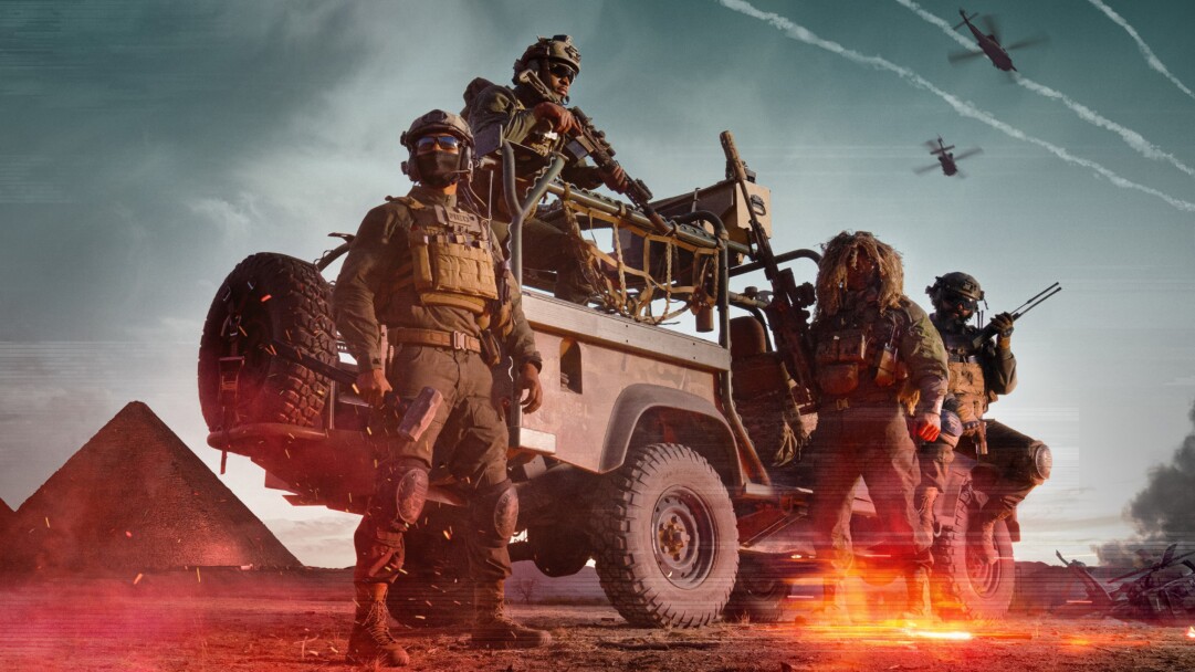 A dynamic 4K wallpaper showcases heavily armed military operatives and their rugged vehicle in a vast desert landscape, with ancient pyramids looming in the background. Fiery explosions and smoke engulf the foreground as combat helicopters sweep across the sky, setting a tense, action-packed mood for the Battlefield 6 official art.