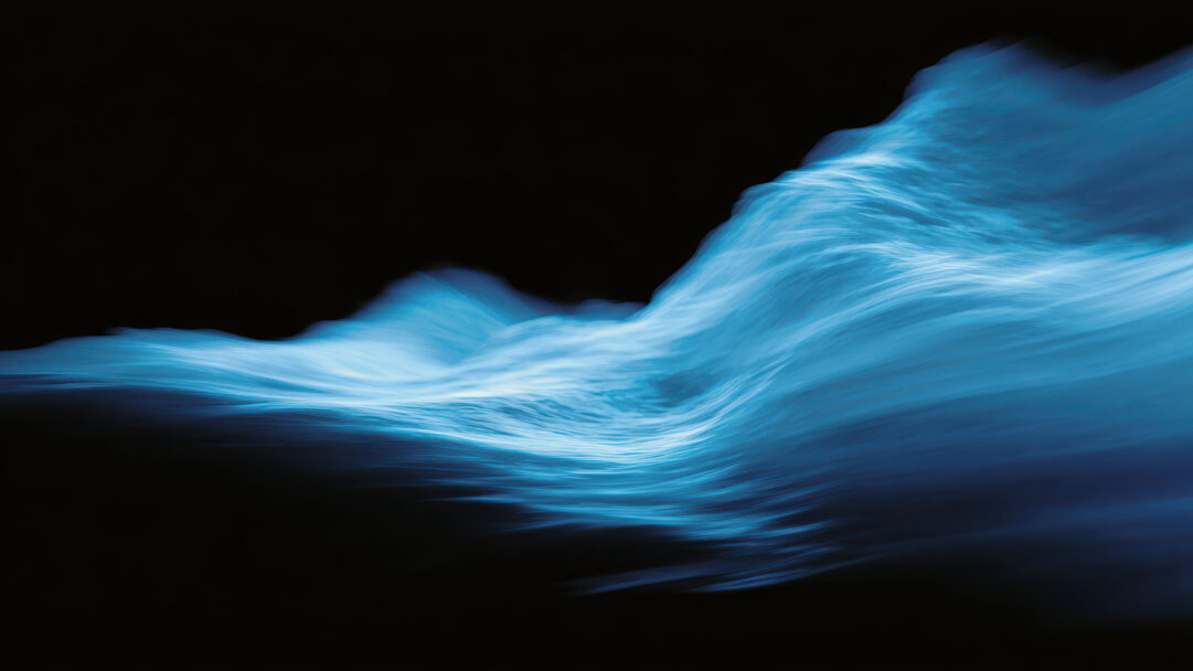 An enchanting 4K wallpaper featuring luminous blue abstract energy waves, dynamically flowing across a deep black void. The waves exhibit a captivating interplay of light, with brighter, almost white crests contrasting against darker, more subdued blues, creating a sense of graceful, powerful motion.