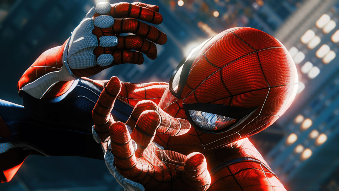 A stunning 4K wallpaper featuring a close-up, dynamic shot of Marvel's Spider-Man in his iconic red and blue suit, ready for action against a blurred backdrop of a city at dusk or night. The intricate texture of his suit, the reflective glare in his eyes, and the dramatic lighting emphasize his powerful presence and the high-fidelity graphics of the game.