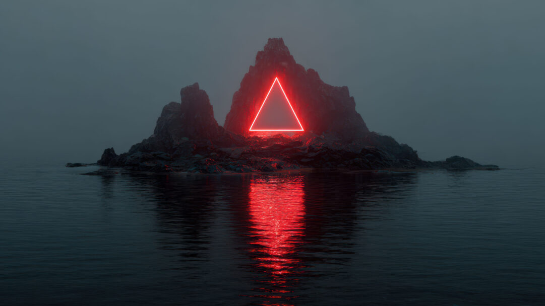 A surreal 4K wallpaper showcasing a prominent red neon triangle positioned on a dark, rugged rocky island. Its powerful red glow vividly illuminates the surrounding crags and forms a mesmerizing, elongated reflection on the still water below, creating an intense, enigmatic ambiance.