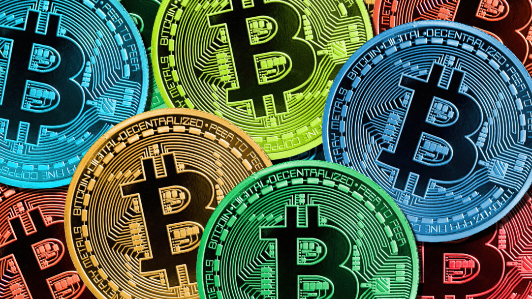 A dynamic 4K wallpaper presenting a dense, overlapping array of vibrant digital Bitcoin cryptocurrency coins, each featuring intricate blockchain circuit patterns. The varied, luminous hues of blue, lime green, gold, and red powerfully highlight their metallic textures and intricate circuitry, creating an energetic and futuristic mood.