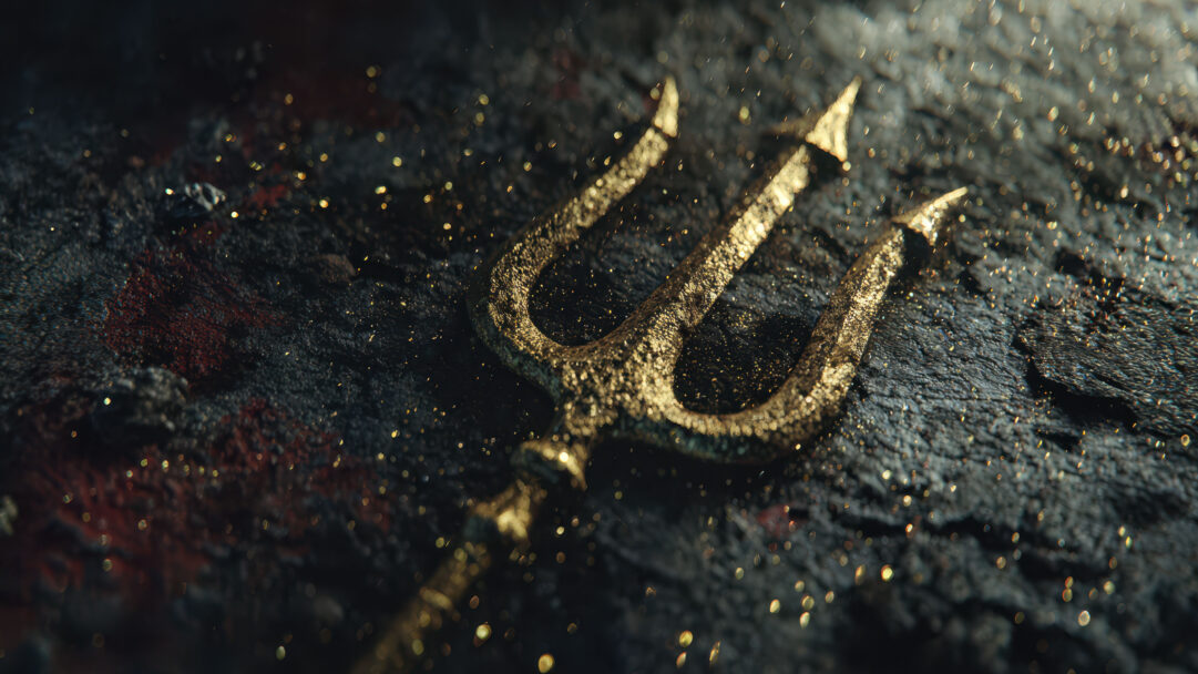 A mystical 4K wallpaper presenting a heavily textured golden trident resting on a rugged, dark background. Hundreds of tiny golden particles shimmer around it, illuminated by subtle light, creating an ancient and powerful mood against the deep, dark surface.
