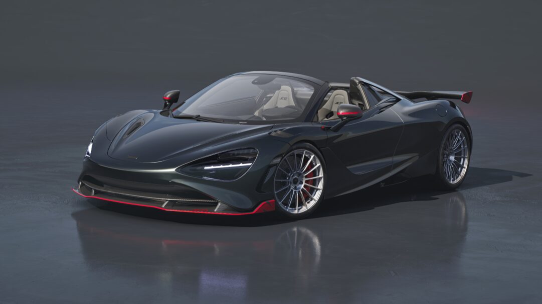 An exquisite 4K wallpaper showcasing the McLaren 750S JC96 Japan Limited Edition Convertible, presented in a sleek dark metallic grey with subtle red accents, parked elegantly on a smooth, reflective dark surface. Its glowing LED headlights and vibrant red details, including the front splitter and brake calipers, subtly reflect on the glossy ground, emphasizing its exclusive, high-performance aesthetic.