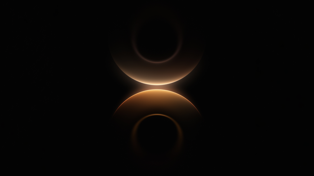 A mesmerizing 4K wallpaper featuring abstract orange gold arcs against a deep black background. The two luminous arcs subtly reflect each other, glowing intensely where they almost meet at the center, creating a soft, ethereal light transition that evokes a sense of cosmic serenity.
