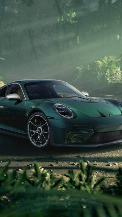 An atmospheric 4K wallpaper presents a sleek green Porsche 911 sports car parked on a dirt road within a dense, misty jungle. Sunlight beams pierce through the thick canopy and ethereal mist, illuminating the car's vibrant green finish and creating a dramatic, adventurous mood amidst the abundant tropical foliage.