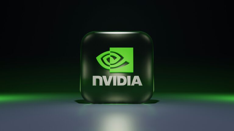 A captivating 4K wallpaper showcases a prominent 3D NVIDIA logo, featuring a dark green rounded cube with a vibrant bright green symbol and white 'NVIDIA' text, centered on a reflective surface against a deep, dark background. The vivid green elements glow subtly, creating a sleek, futuristic ambiance that permeates the minimalist scene.
