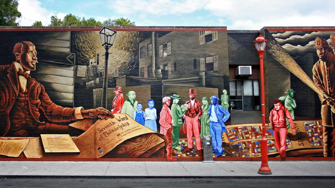 A profound 4K wallpaper showcases the expansive Willis Humphrey Seventh Ward Philadelphia Mural Art, vividly painted across a long brick wall on a city street. The detailed artwork juxtaposes historical figures, including Willis Humphrey presenting a Seventh Ward of Philadelphia document, with translucent, vibrantly colored residents set against a backdrop of past urban life and a watchful guardian.